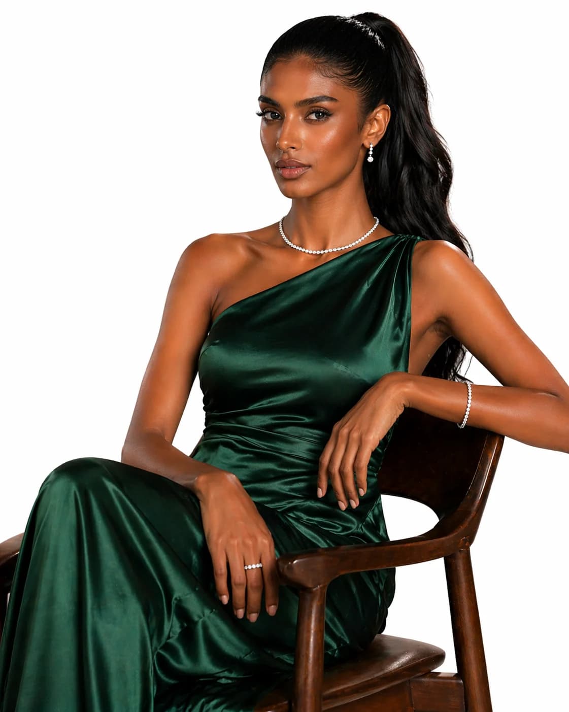 A customer wearing an emerald necklace